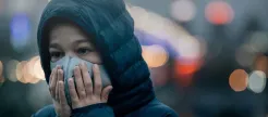 A child wearing a face mask for protection against smog. (Photo: Shutterstock)